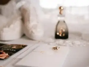 wedding ring sitting on a wedding invitation